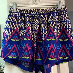 Francesca’s brand fun, geometric neon shorts with pockets. Size unknown S or M?